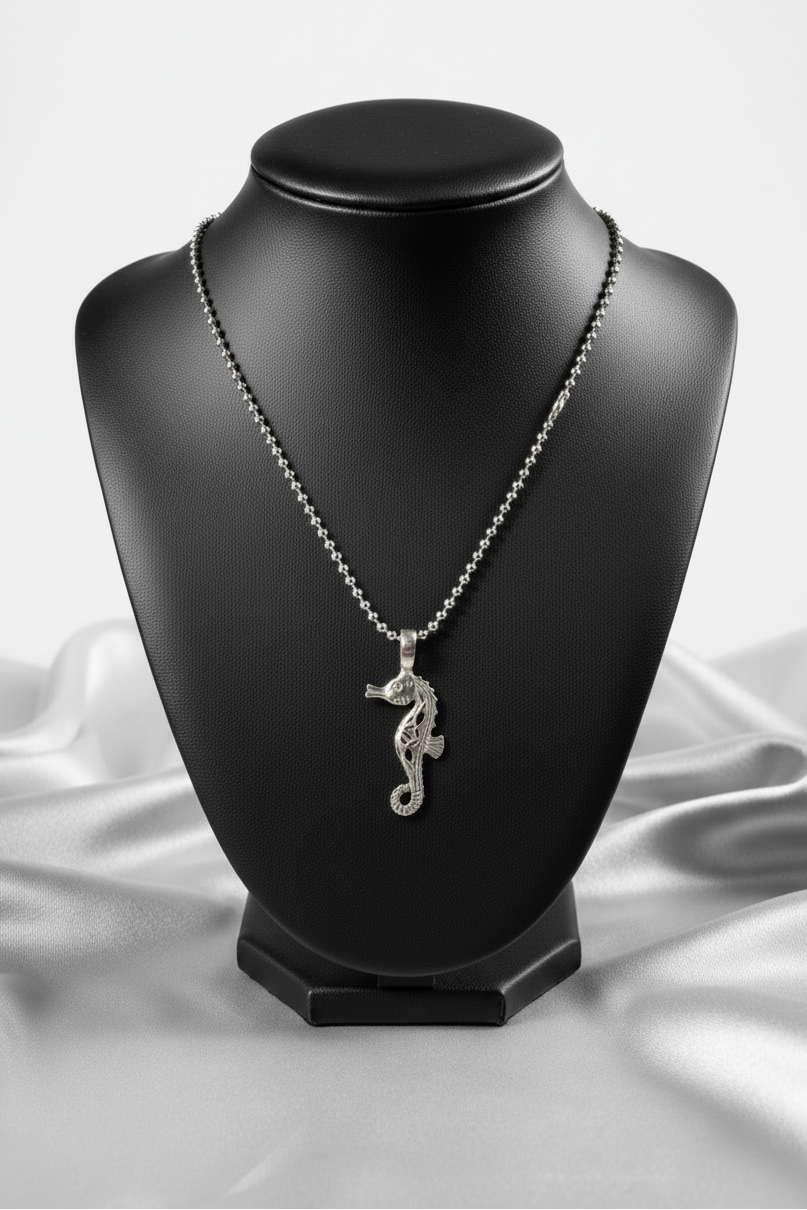Seahorse Steel Chain Necklace in 316l stainless steel on a black bust.