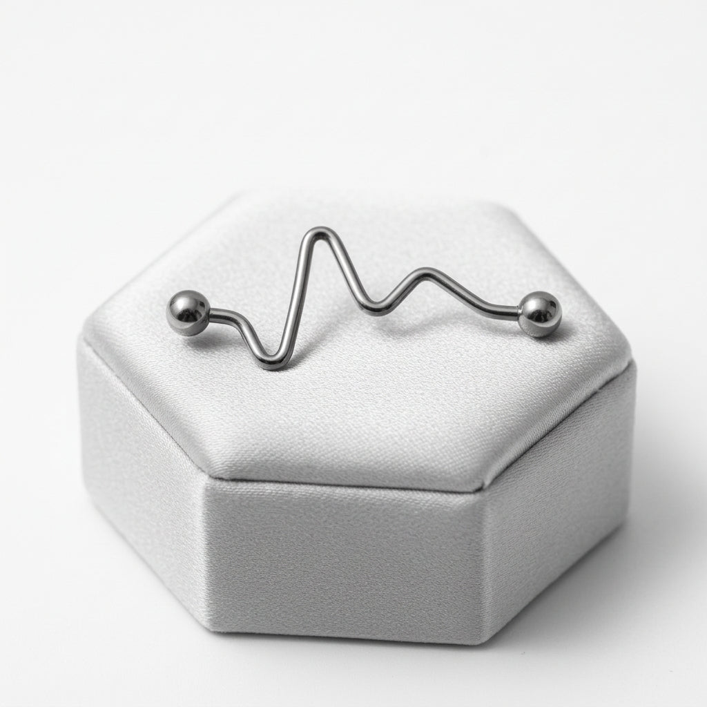 Zigzag Industrial Ear Barbell in 316l stainless steel on a silver silk jewelry display.