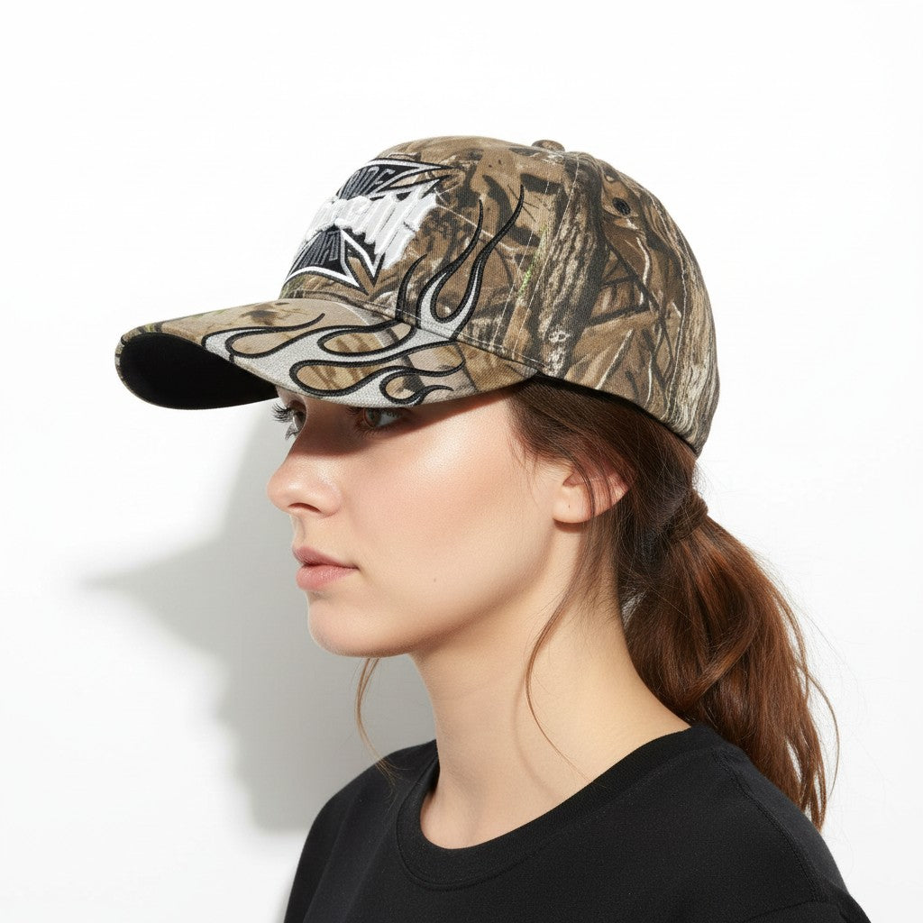 Maltese Cross "No Fear" Adjustable Camouflage Baseball Cap with a white background on a female model side profile.