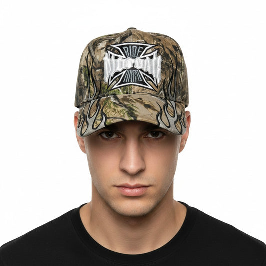 Maltese Cross "No Fear" Adjustable Camouflage Baseball Cap with a white background on a male model front profile.