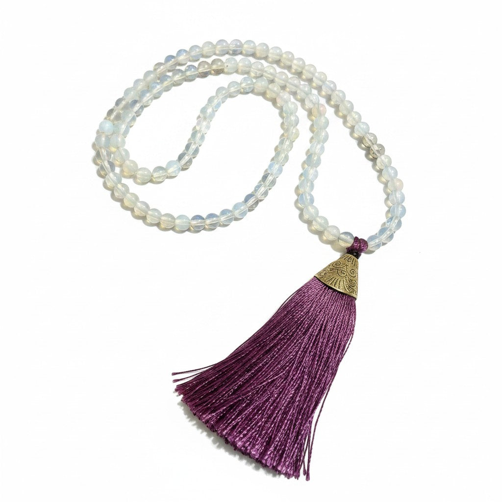 Opalite Bead Mala with Purple Silk Tassel on a white background showing bead and tassel detail.