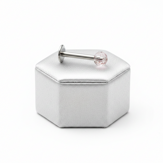 Light Pink Acrylic Labret Lip Ring in 316l stainless steel on a silver silk jewelry display.