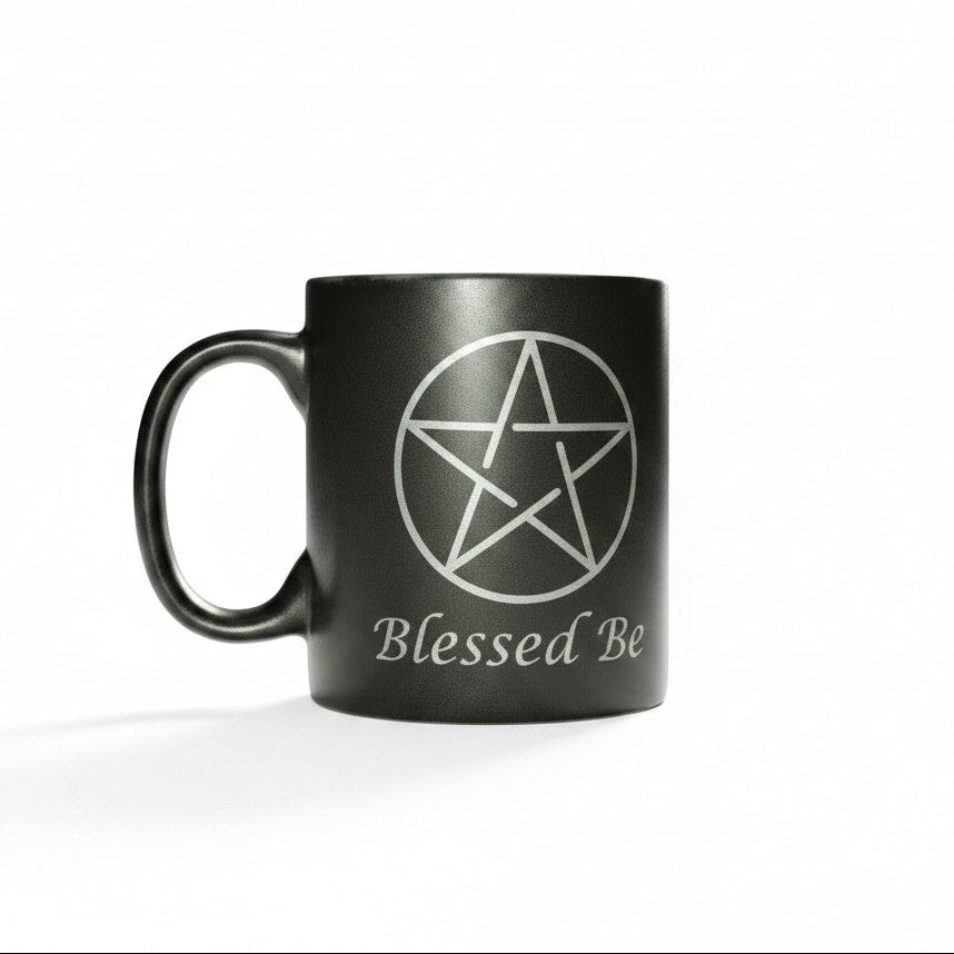 Pentagram Blessed Be Black Ceramic Spiritual Coffee Mug on a white background showing close up design detail.