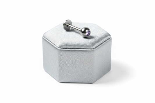 Light Purple Crystal Labret Lip Ring in 316l stainless steel on a silver silk jewelry display.