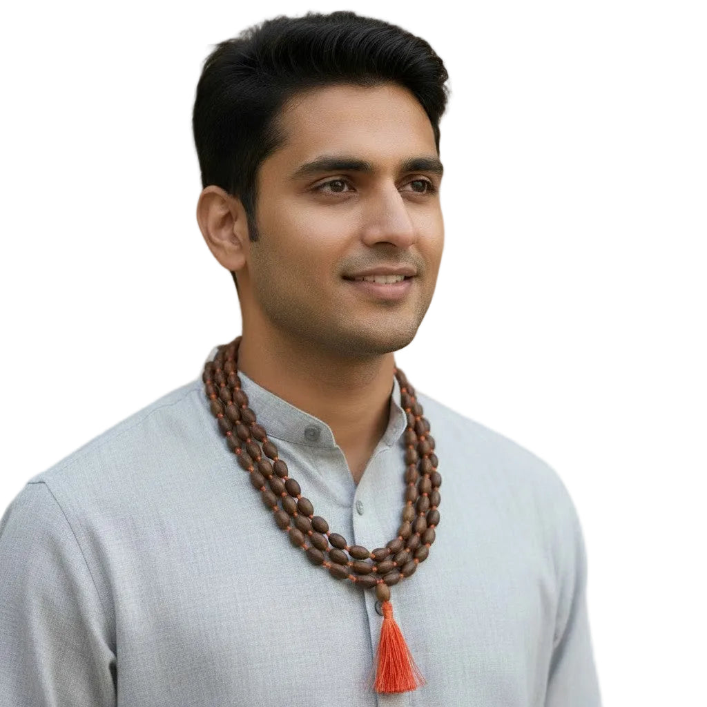 Sacred Lotus Seed Mala with Red Silk Tassel around the neck of an East Indian male model worn as a necklace.