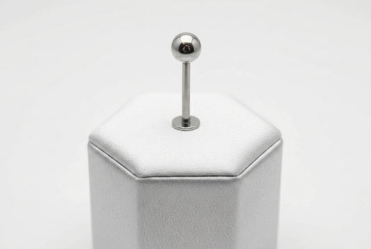 Polished Steel Ball Labret Lip Ring in 316l stainless steel on a silver silk jewelry display