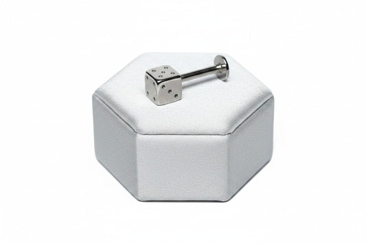 Steel Dice Labret Lip Ring in 316l stainless steel on a silver silk jewelry display.