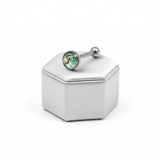 Aqua Camouflage Tongue Barbell in 316l stainless steel on a silver silk jewelry display.