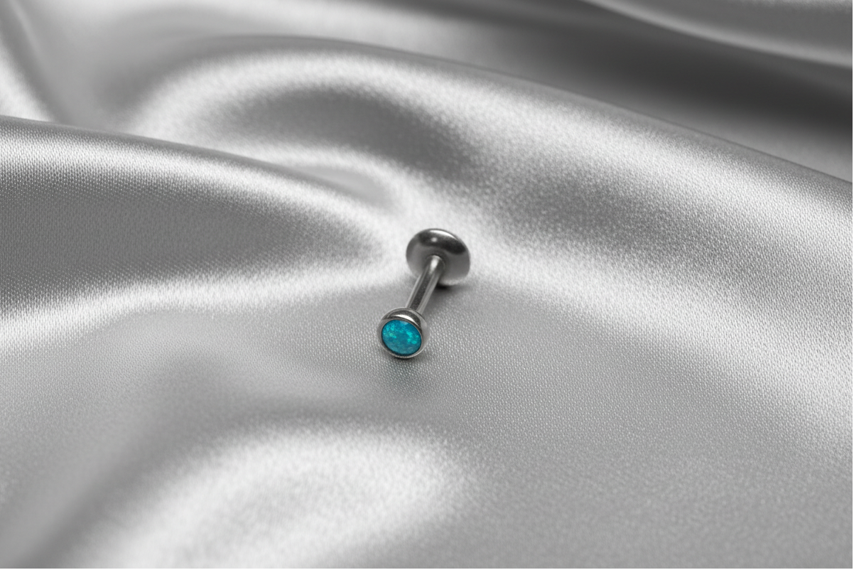 Internally Threaded Ocean Aqua Opal Labret Lip Ring in 316l stainless steel.