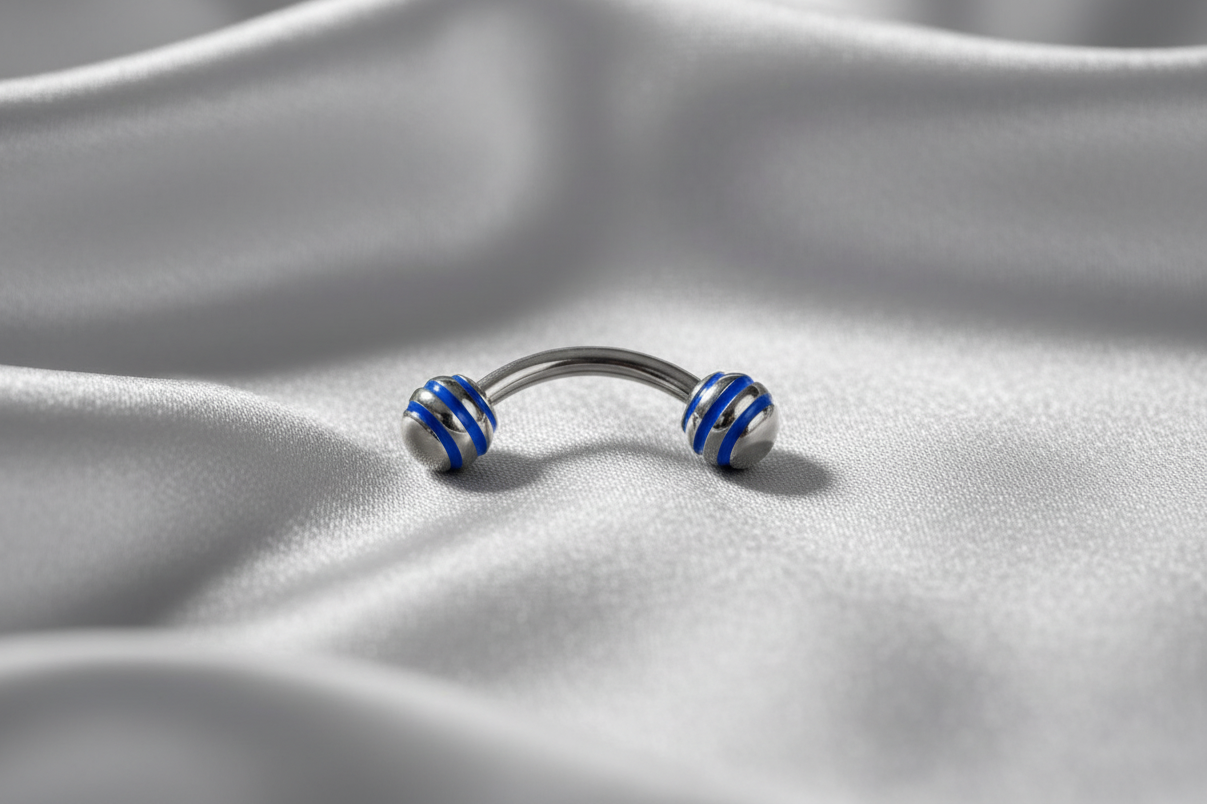 Blue Striped Steel Ball Eyebrow Ring in 316l stainless steel.