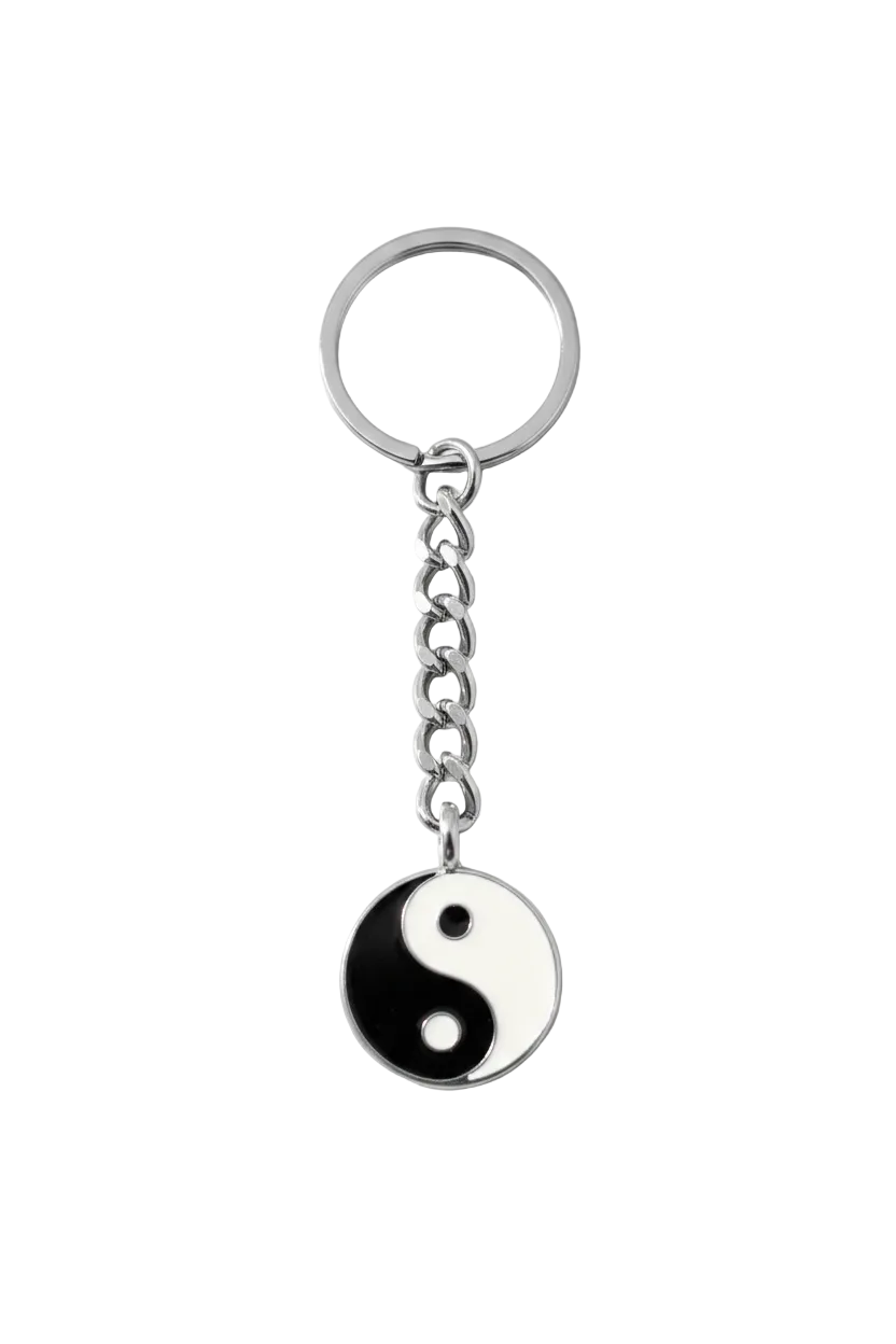 Black and White Enamel Yin Yang Handmade Pewter Charm Keychain on a white background.