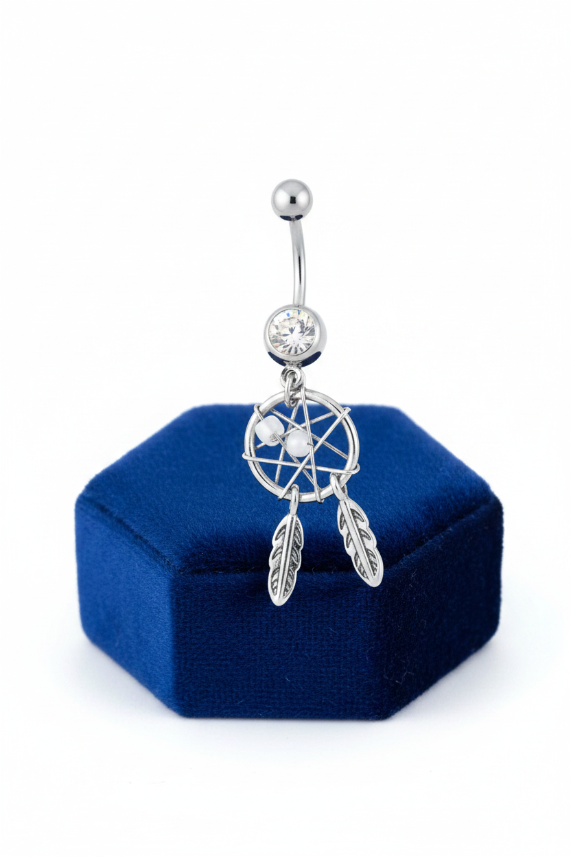 Clear Crystal Mystical Dream Catcher Belly Button Ring in 316l stainless steel on a blue velvet jewelry display.
