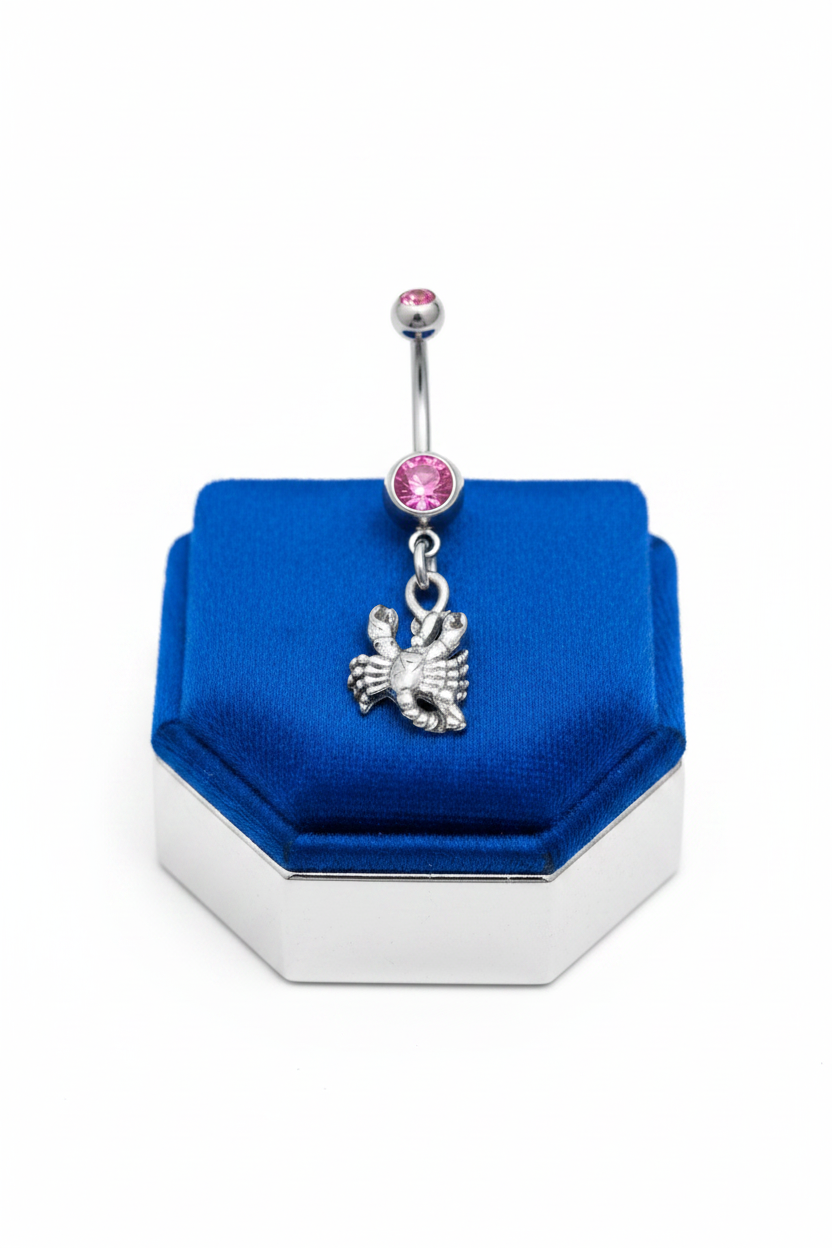 Pink Crystal Scorpio Belly Button Ring in 316l stainless steel on a blue velvet jewelry display.