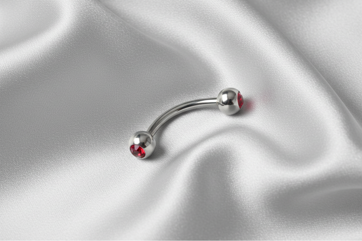 Red Crystal Eyebrow Ring in 316l stainless steel.