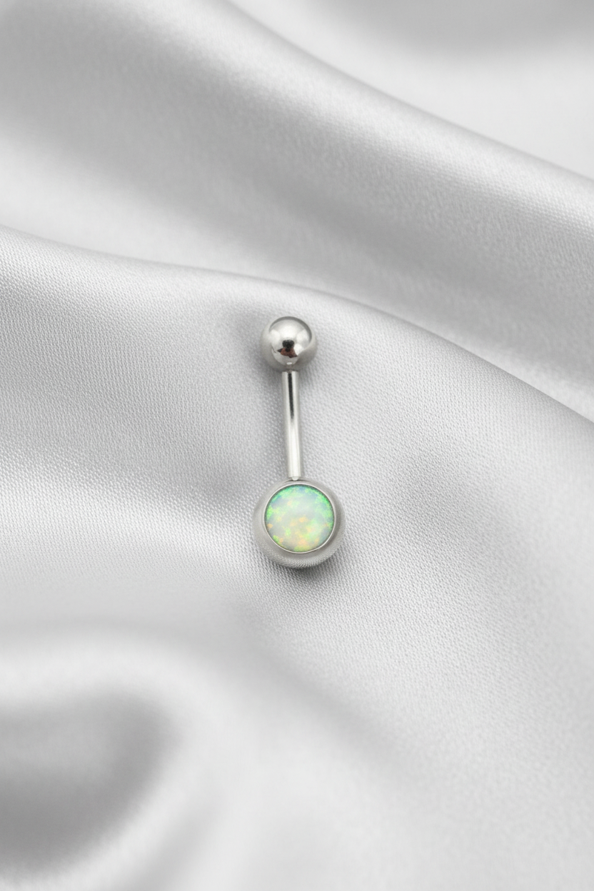 Aqua Opal Belly Button Ring in 316l stainless steel on silver silk fabric.