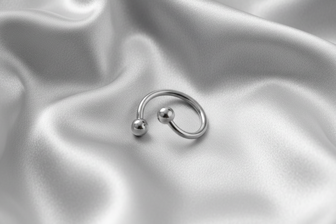 Multi-Purpose Steel Curled Barbell in 316l stainless steel front facing angle.