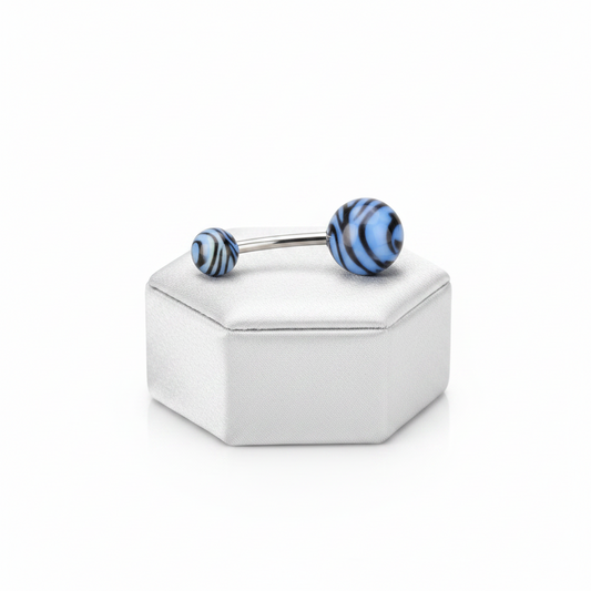 Blue Tiger Striped Acrylic Belly Button Ring in 316l stainless steel on a silver silk jewelry display.