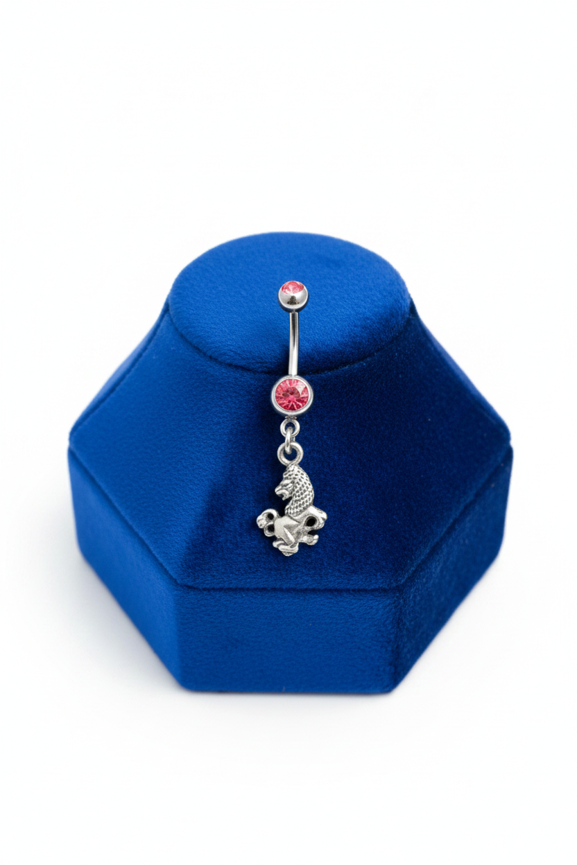 Red Crystal Leo Belly Button Ring in 316l stainless steel on a blue velvet jewelry display.