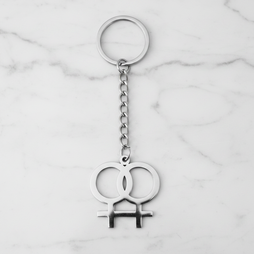 Venus Pride Handmade 316L Stainless Steel Charm Keychain on a white marble surface.