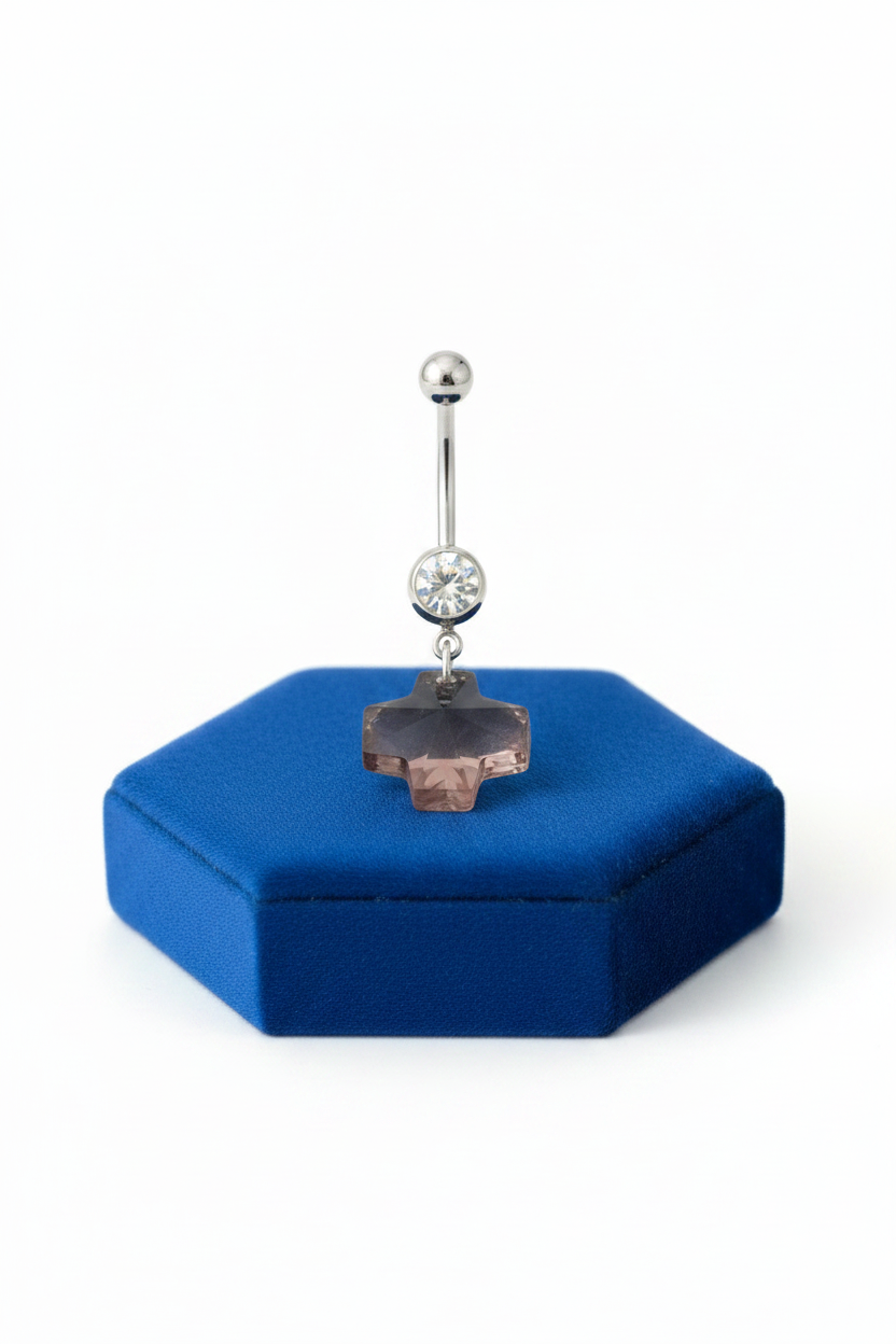 Purple Swarovski Crystal Cross Belly Button Ring in 316l stainless steel on a blue velvet jewelry display.