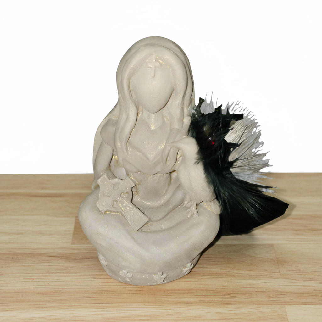 Ancient Goddess Morrigan Terra Cotta Mini Figurine - Altar & Sacred Space on a wooden table with a white background.