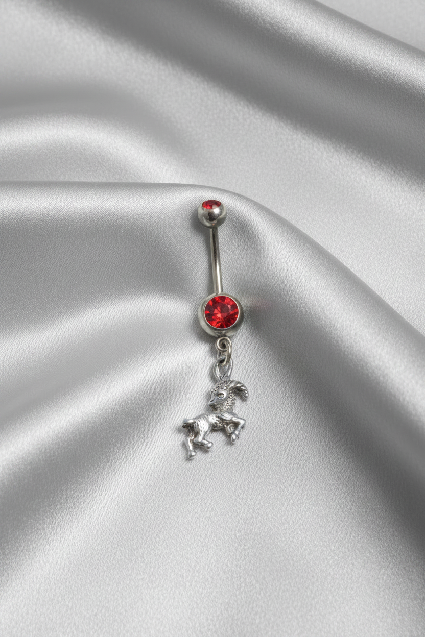 Red Crystal Capricorn Belly Button Ring in 316l stainless steel.