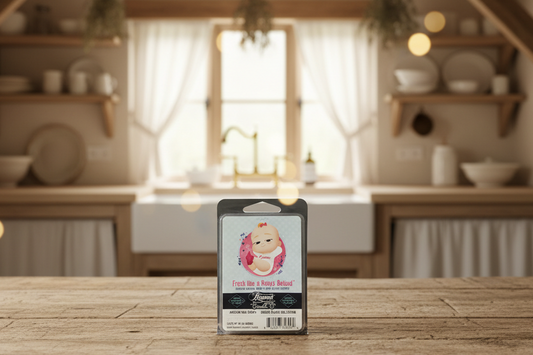 Beamer Smoke Eater "Fresh Like a Baby's Behind" Scented Soy Wax Melt on a wooden table in a country cottage kitchen.