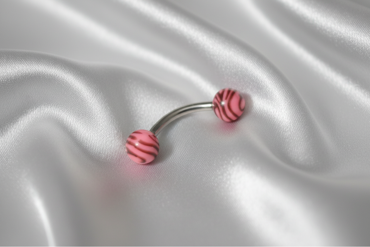 Pink and Black Tiger Striped Acrylic Eyebrow Ring in 316l stainless steel.