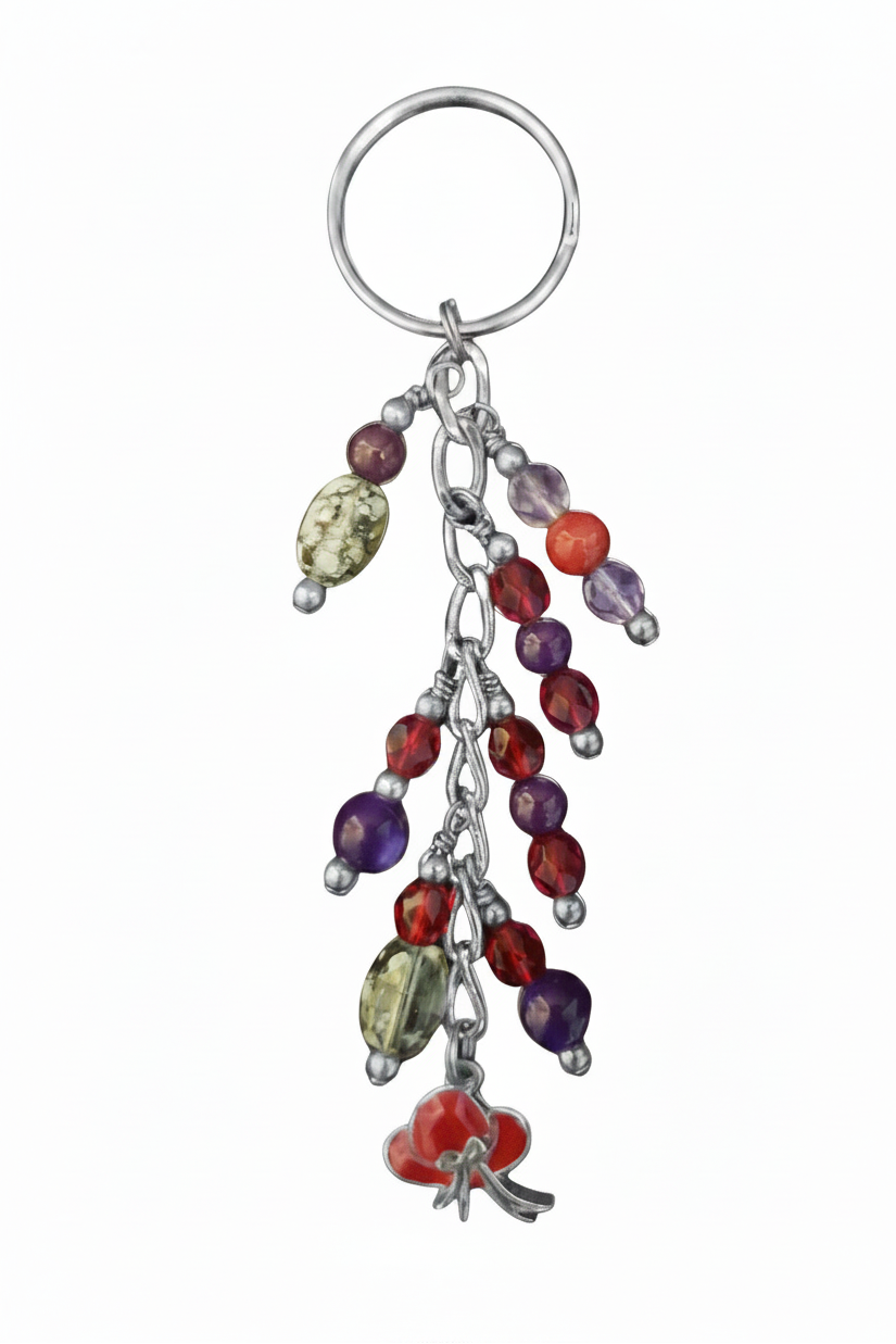 Little Red Enamel Hat Handmade Beaded Keychain on a white background.