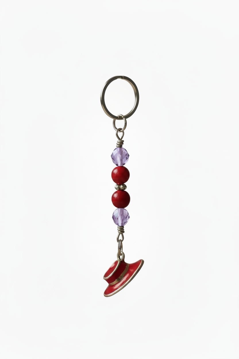 Red Enamel Hat Handmade Beaded Mini Keychain on a white back ground.