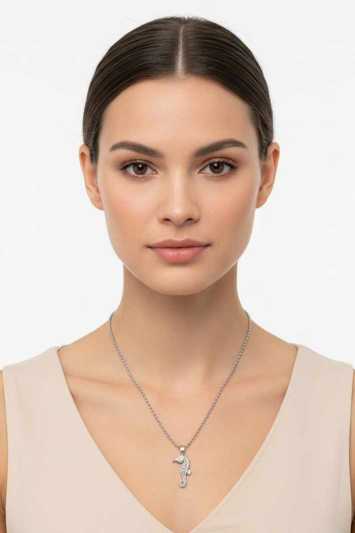 Seahorse Steel Chain Necklace in 316l stainless steel on a female model.