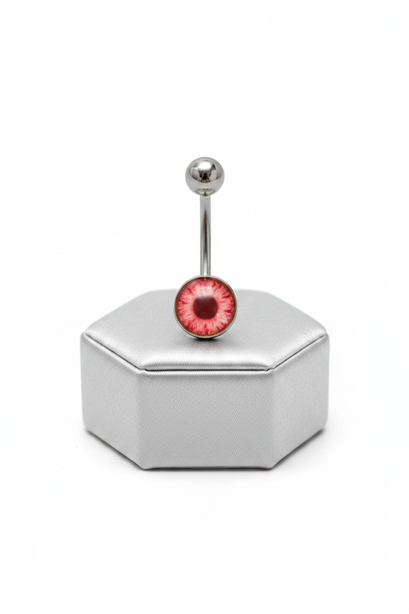 Red Eyeball Belly Button Ring in 316l stainless steel on a silver jewelry display upright position.