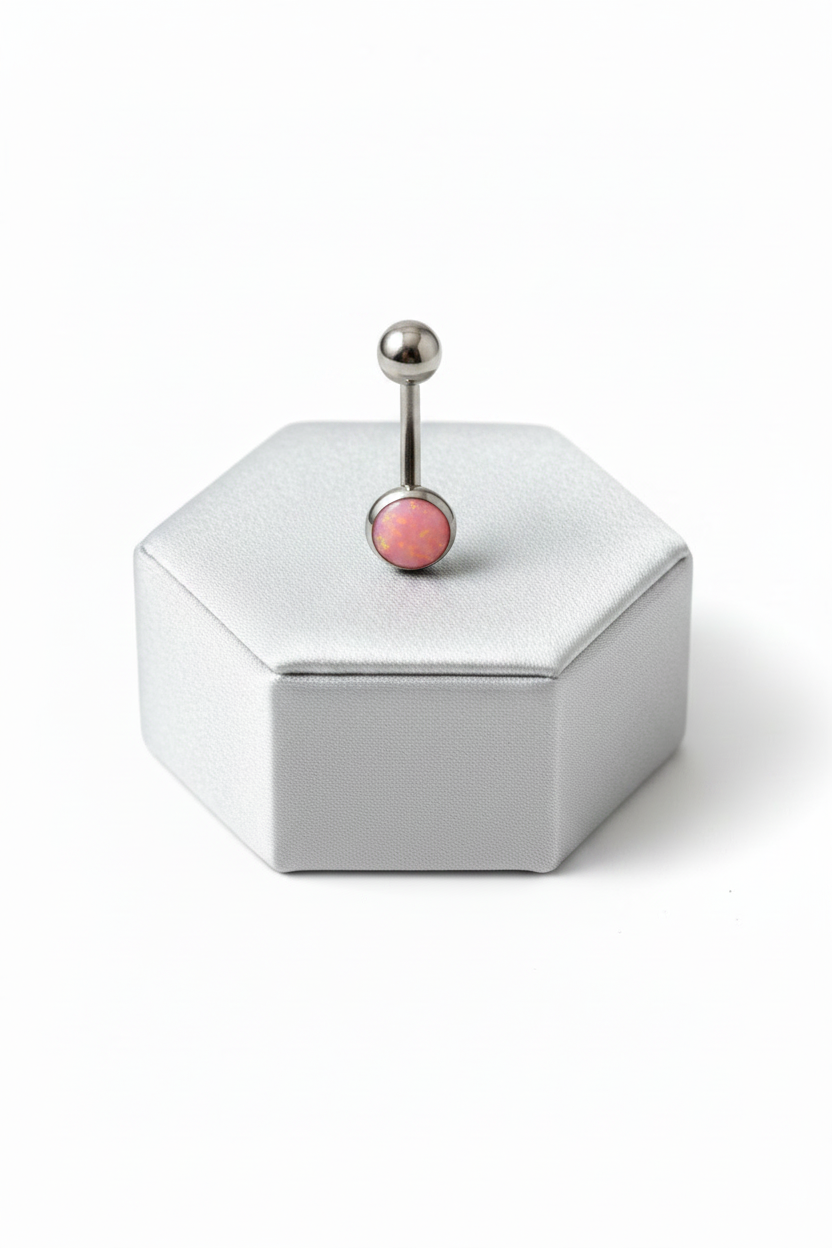 Pink Opal Belly Button Ring in 316l stainless steel on a silver jewelry display upright angle.