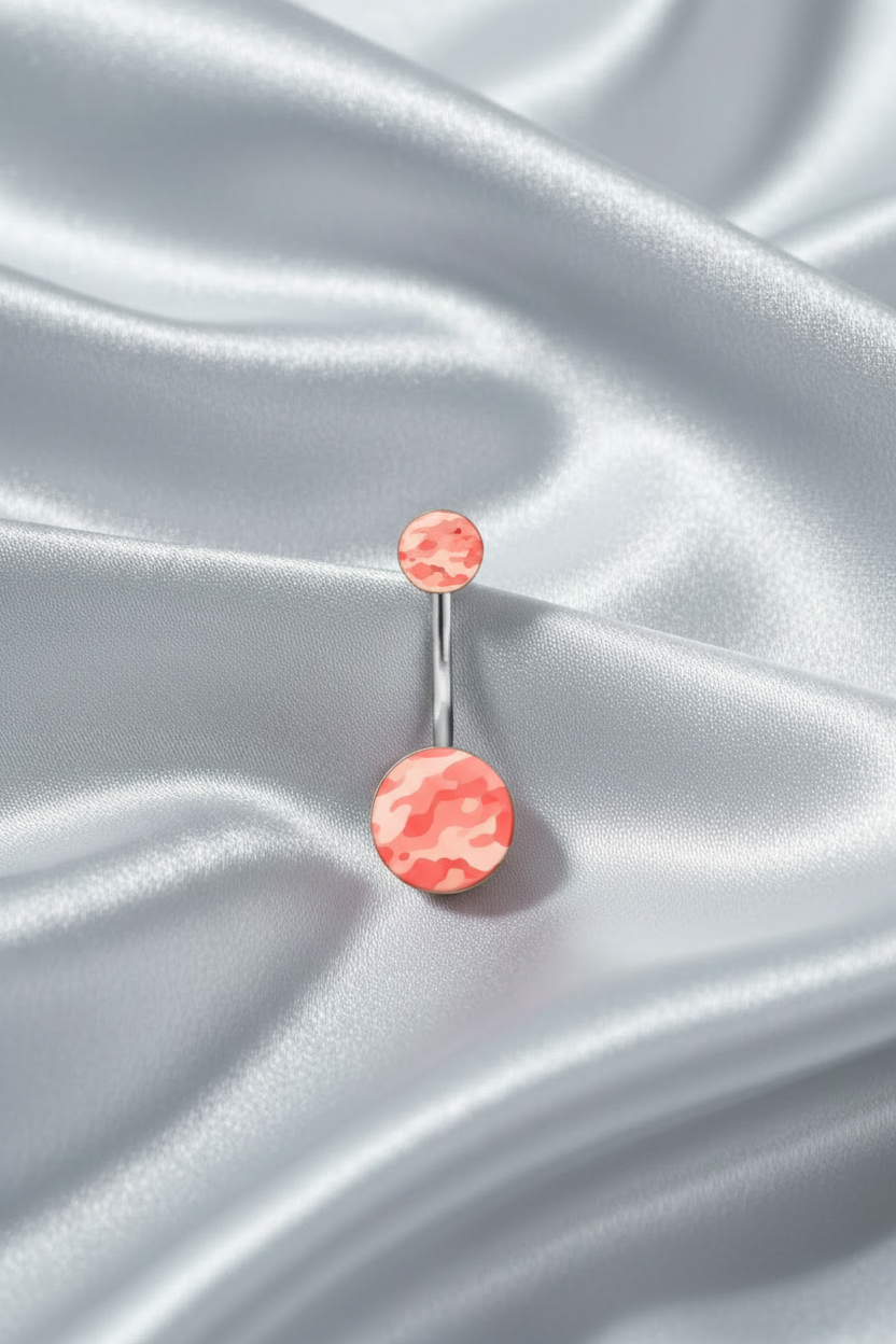 Pink Camouflage Acrylic Belly Button Ring in 316l stainless steel on silver silk fabric.