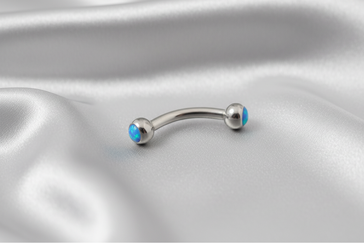 Aqua Opal Eyebrow Ring in 316l stainless steel.