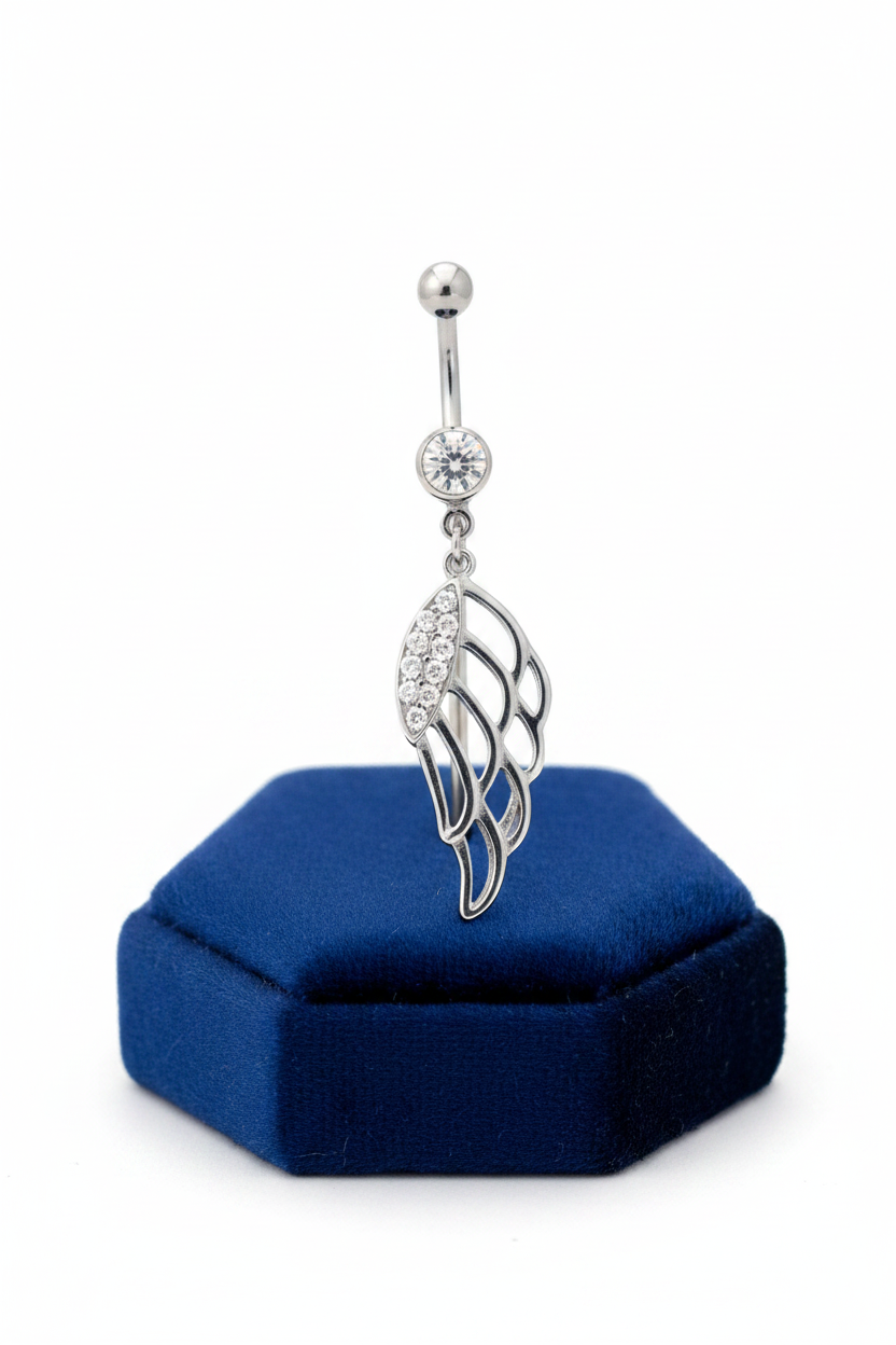 Clear Crystal Wing Belly Button Ring in 316l stainless steel on a blue velvet jewelry display.