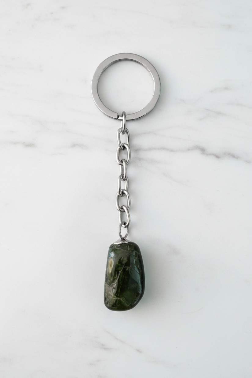 Black Agate Natural Earth Stone Handmade Steel Plated Keychain on a white marble surface.