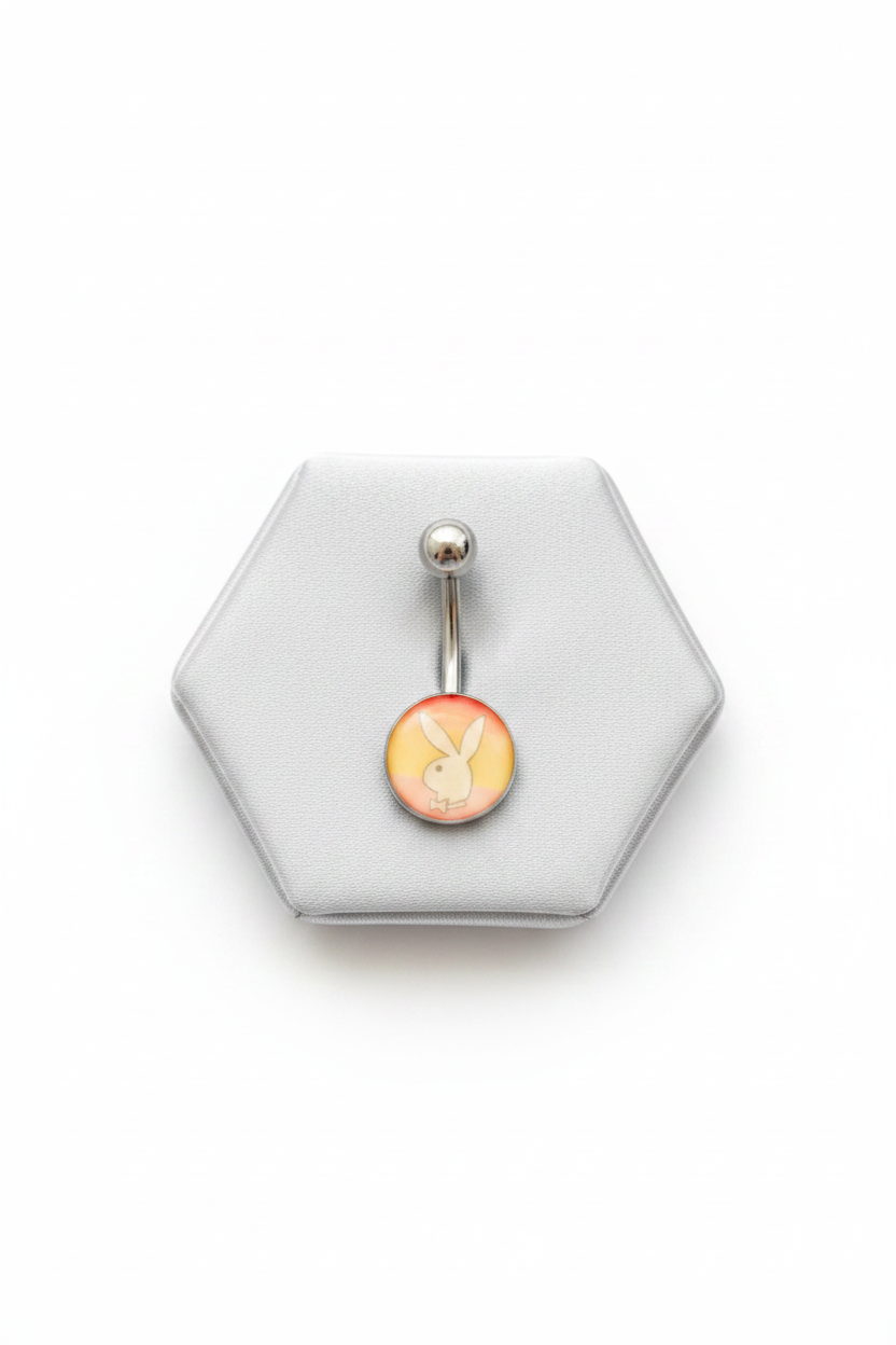 Rainbow Bunny Belly Button Ring in 316l stainless steel on a silver jewelry display front facing.