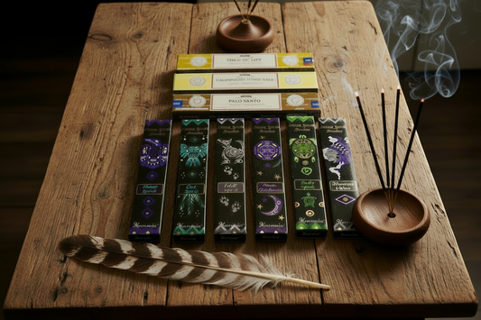 Native Spirits Incense Variety Gift Package on a rustic wooden table with a sacred eagle feather, incense burning and smoke rising.