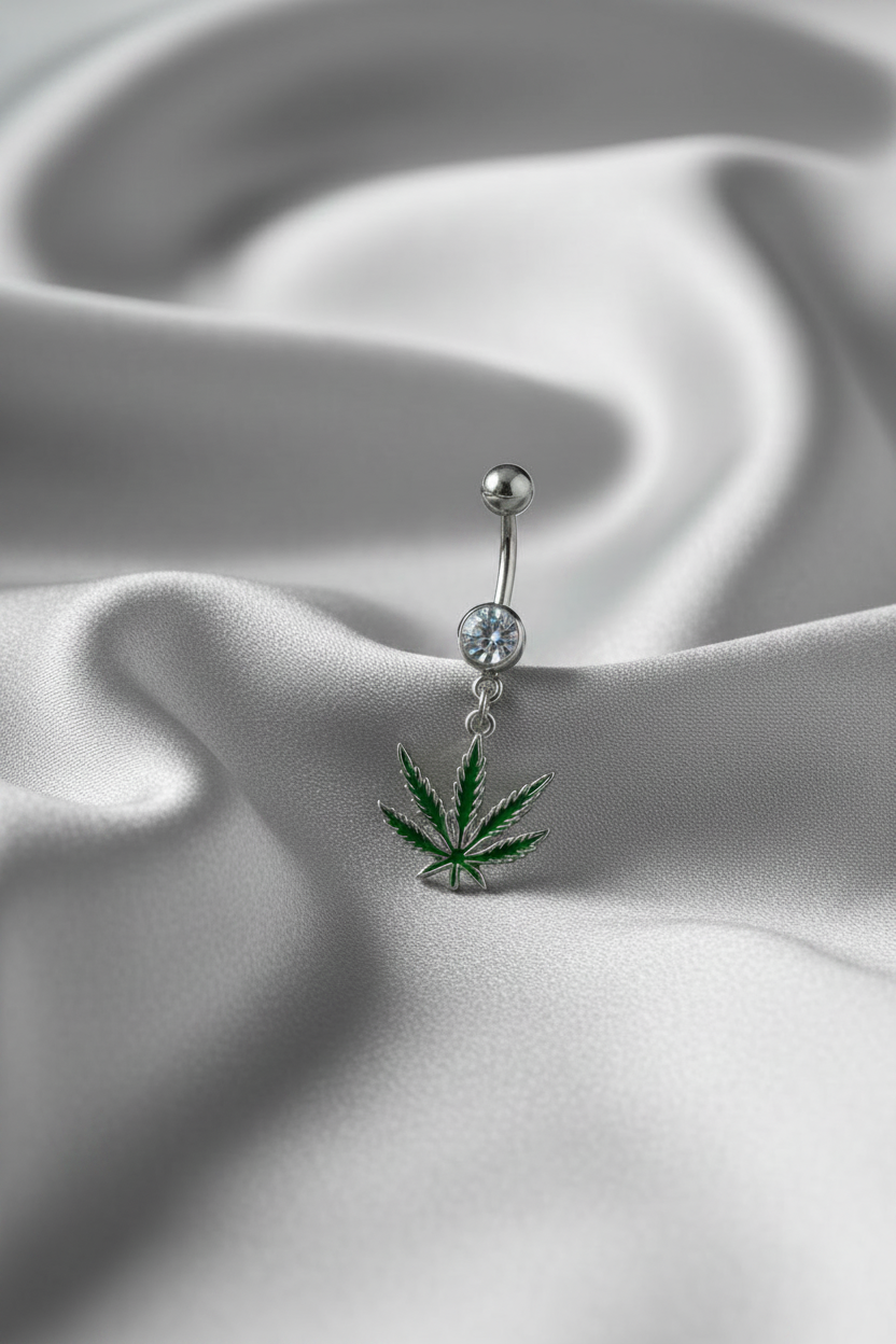 Clear Crystal Sweet Leaf Belly Button Ring in 316l stainless steel on silver silk fabric.