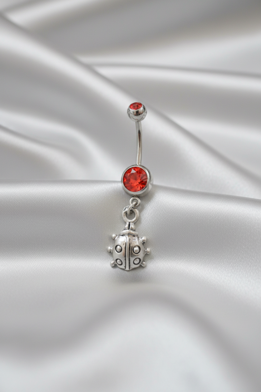 Red Crystal Lady Bug Belly Button Ring in 316l stainless steel.