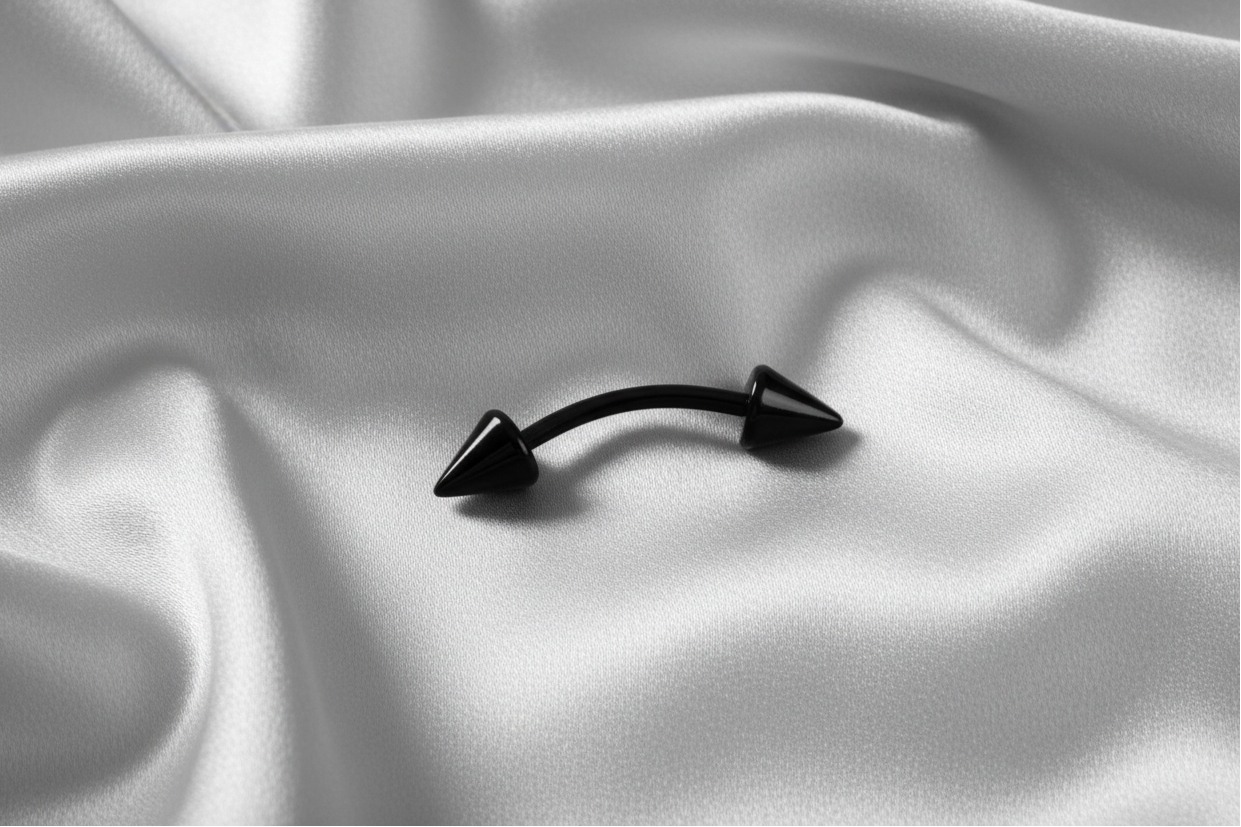 Black Titanium Spiked Eyebrow Ring in black titanium.