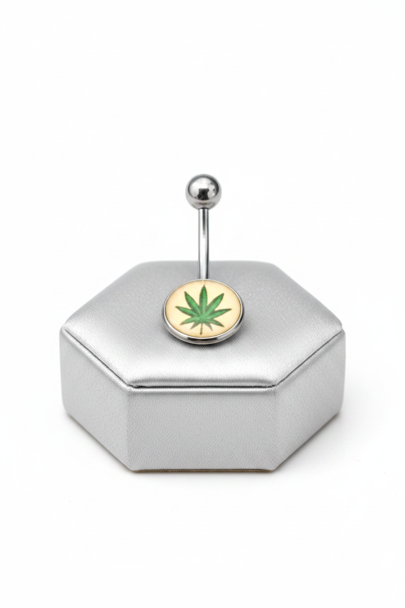 Green Leaf Belly Button Ring in 316l stainless steel on a silver jewelry display.
