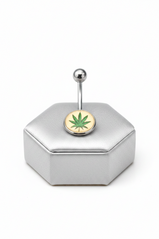 Green Leaf Belly Button Ring in 316l stainless steel on a silver jewelry display.