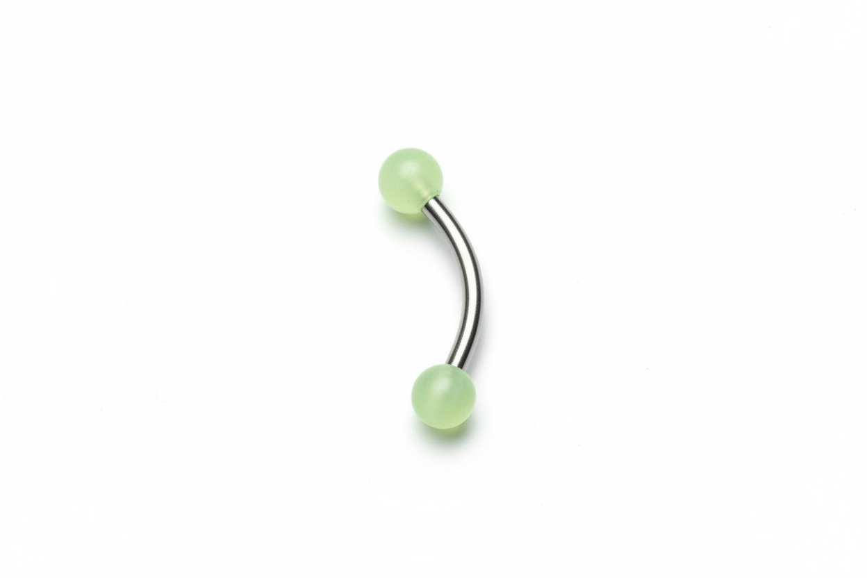 Yellow Glow Ball Acrylic Eyebrow Ring in 316l stainless steel close up detail.