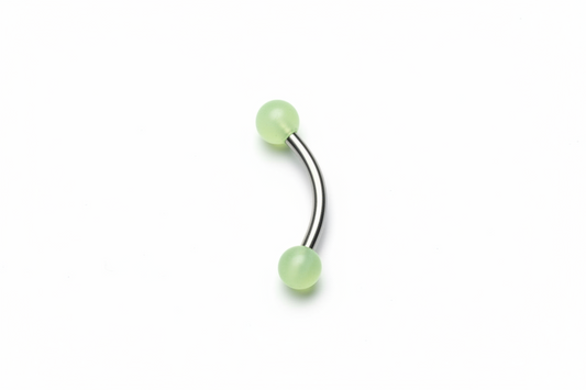 Yellow Glow Ball Acrylic Eyebrow Ring in 316l stainless steel close up detail.