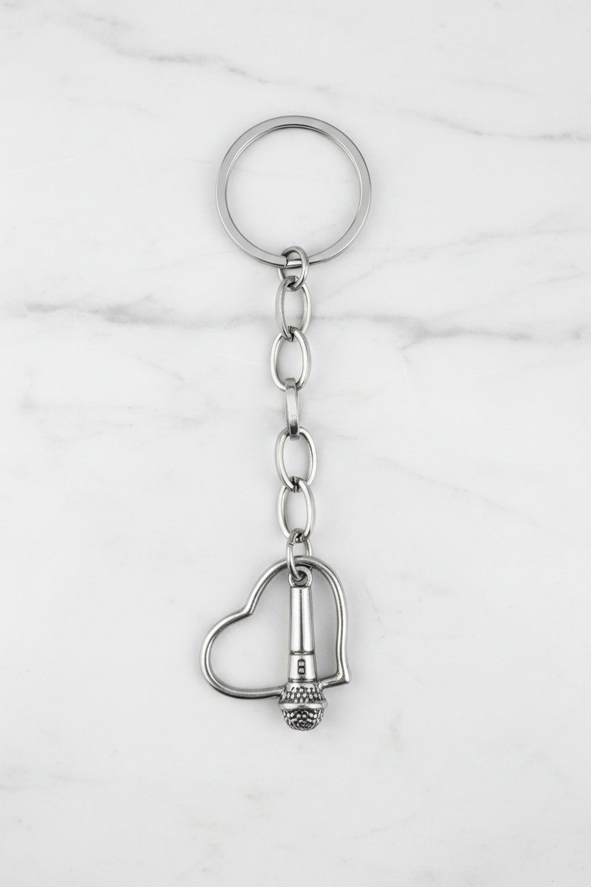 Heart and Microphone Handmade Silver Plated Charm Keychain on a white marble surface.