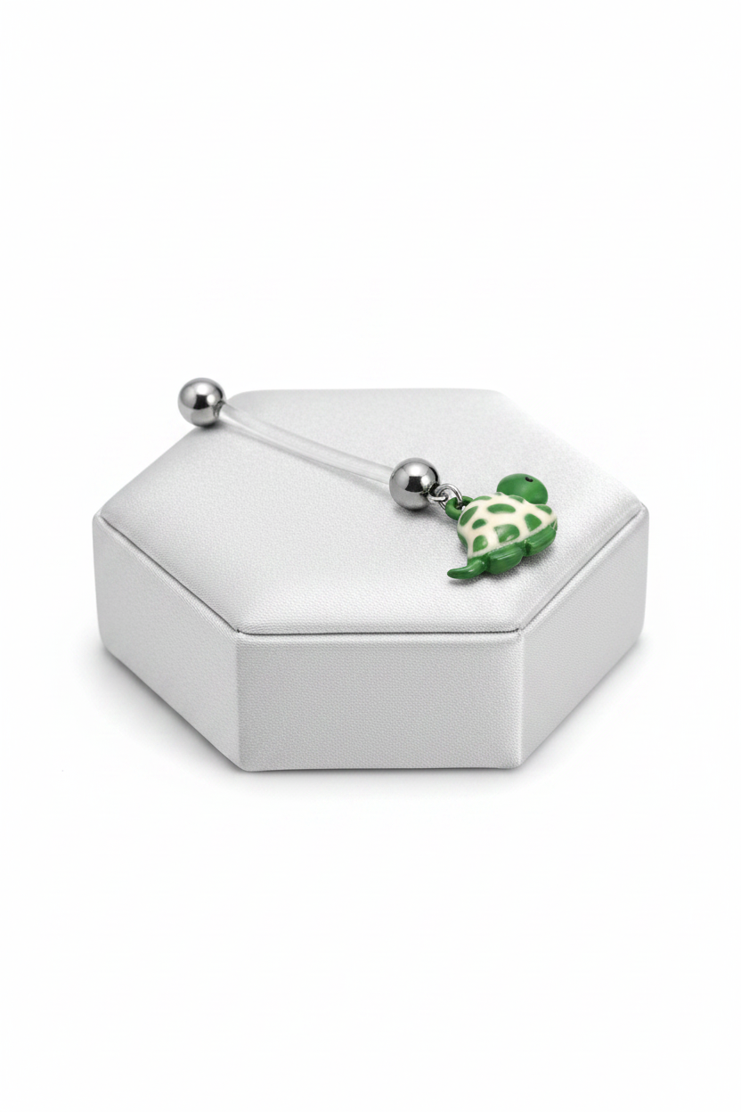 Turtle Acrylic Pregnancy Belly Button Ring in 316l stainless steel on a silver jewelry display.