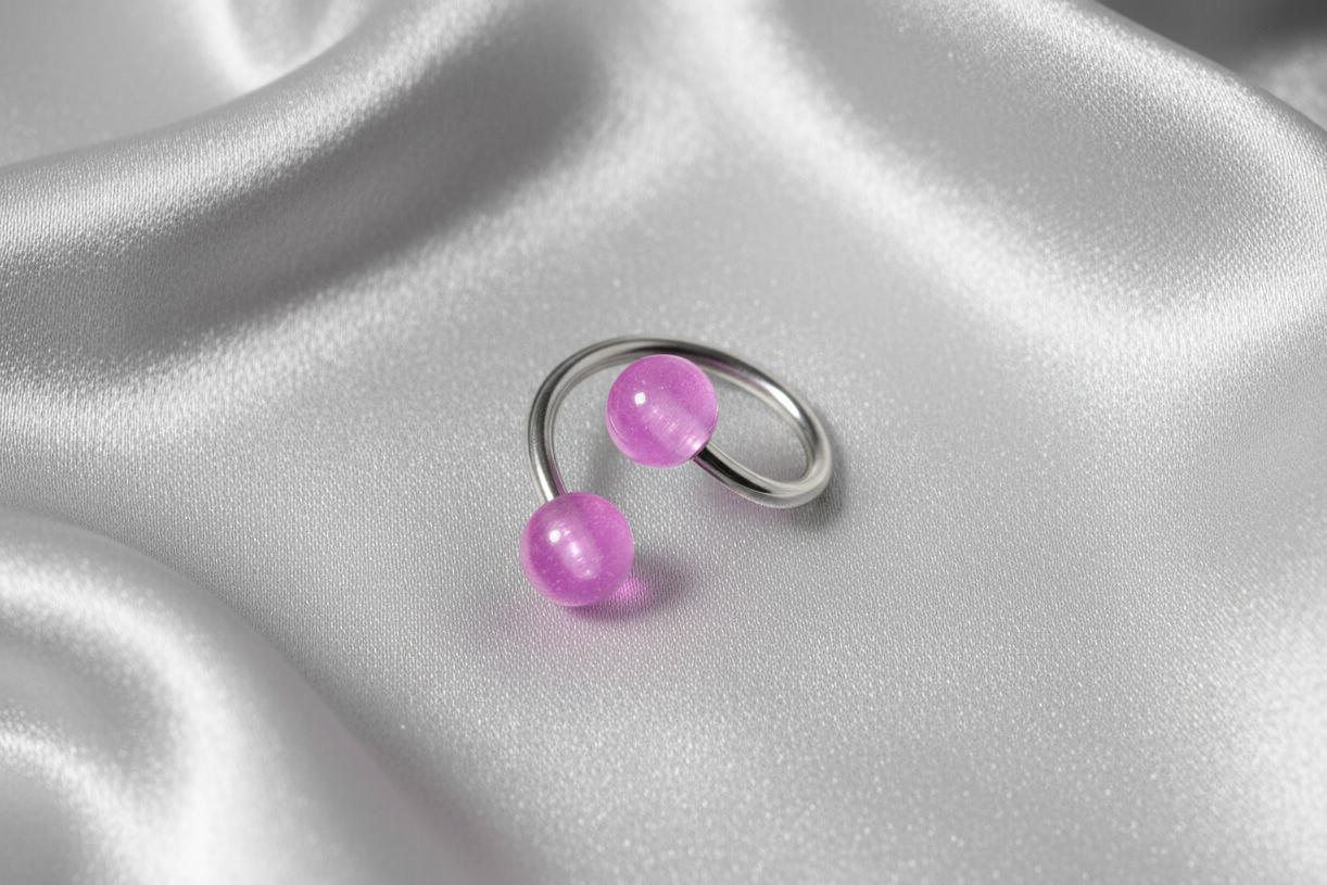 Purple Acrylic Glow Curled Barbell in 316l stainless steel.