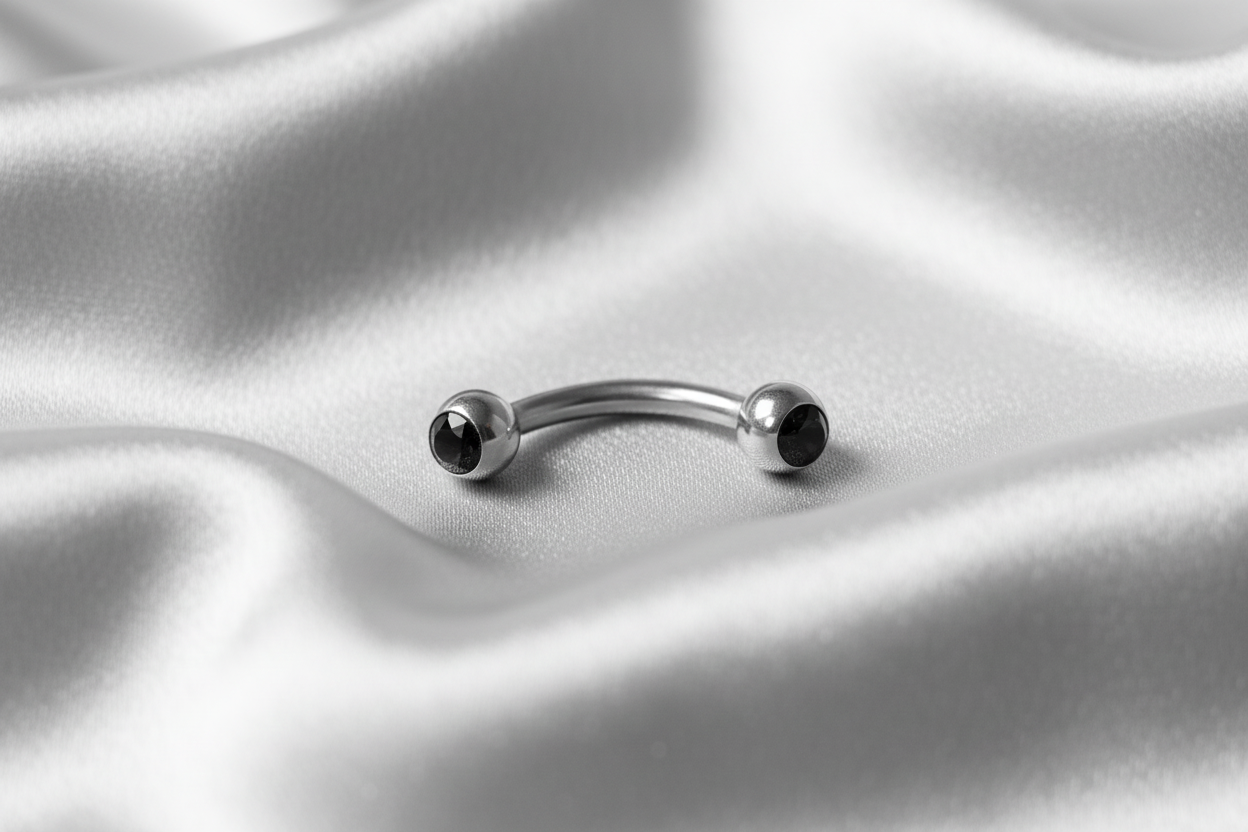 Black Crystal Ball Eyebrow Ring in 316l stainless steel.